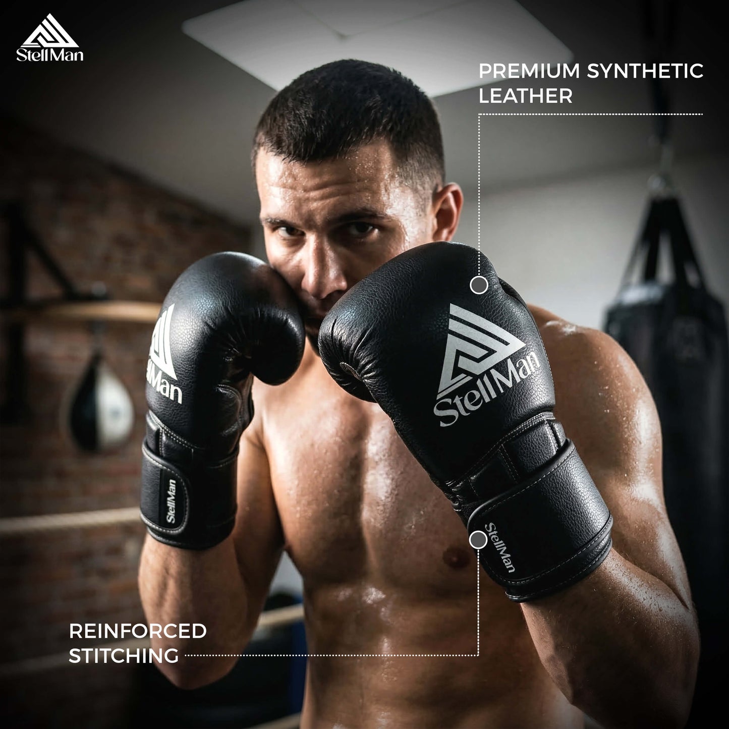Man wearing StellMan boxing gloves in a gym setting